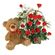 плюшевый мишка с красными розами